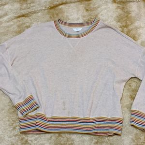 Lightweight ribbed sweater. Cream color with detailed trim cuffs and waist.